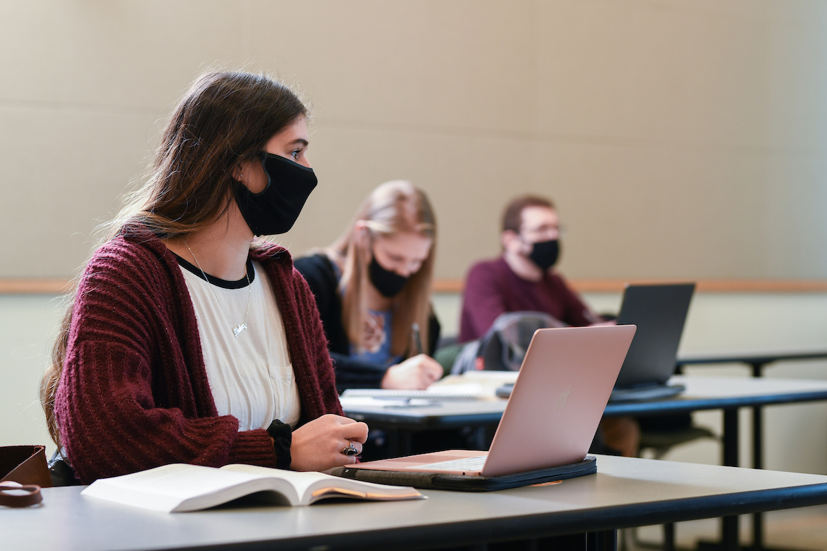 Students with face mask studying