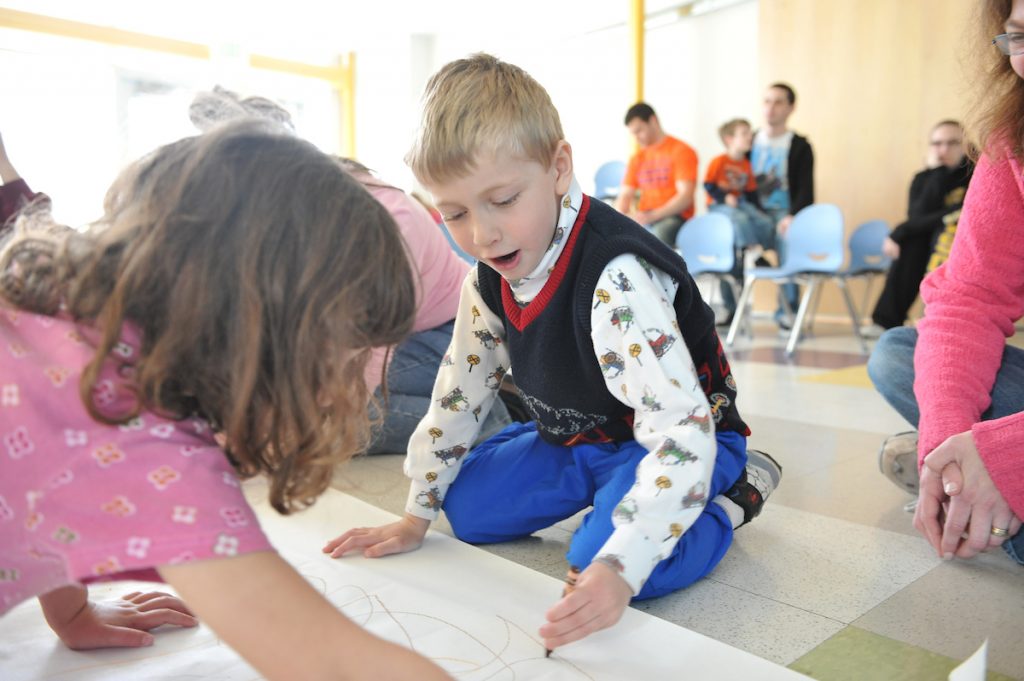 Children drawing on paper